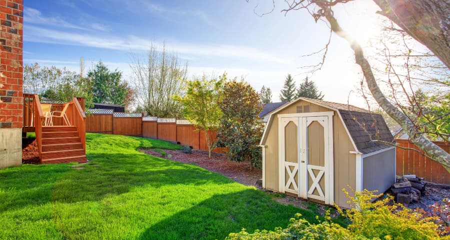 Fenced backyard with storage shed in Riverside